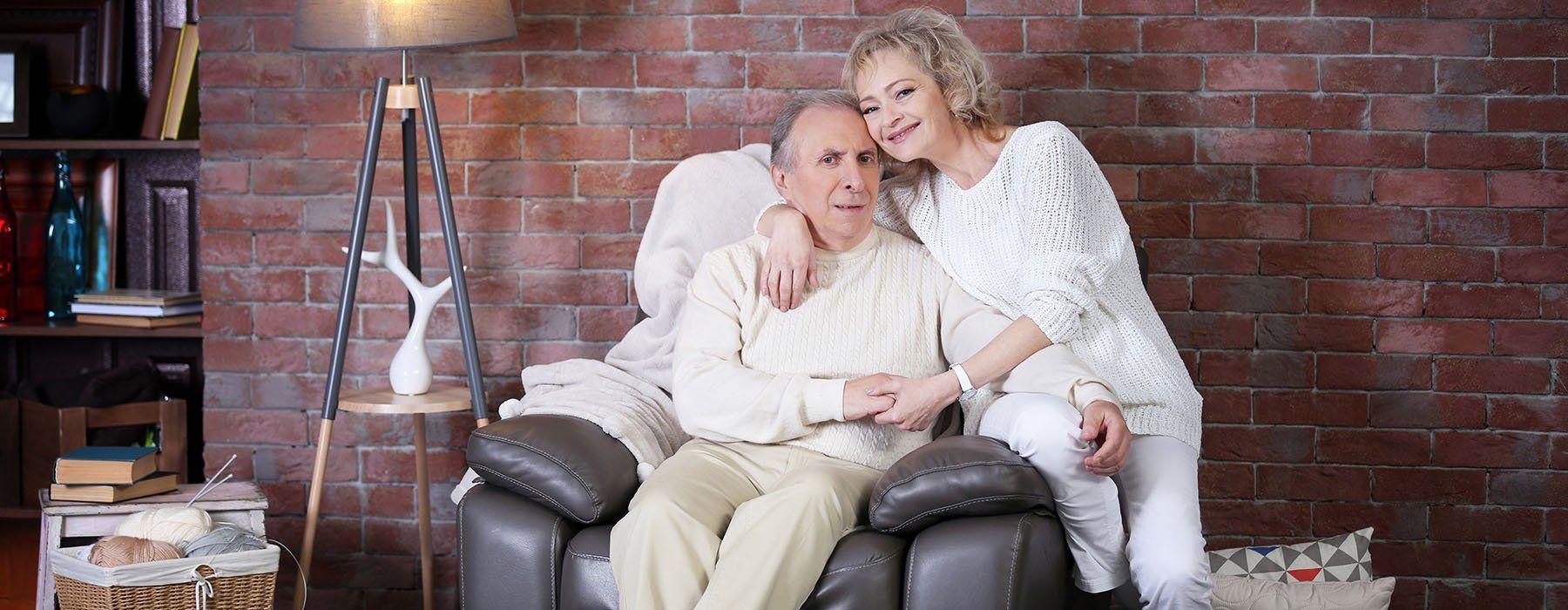 Woman hugging a man on a lift chair