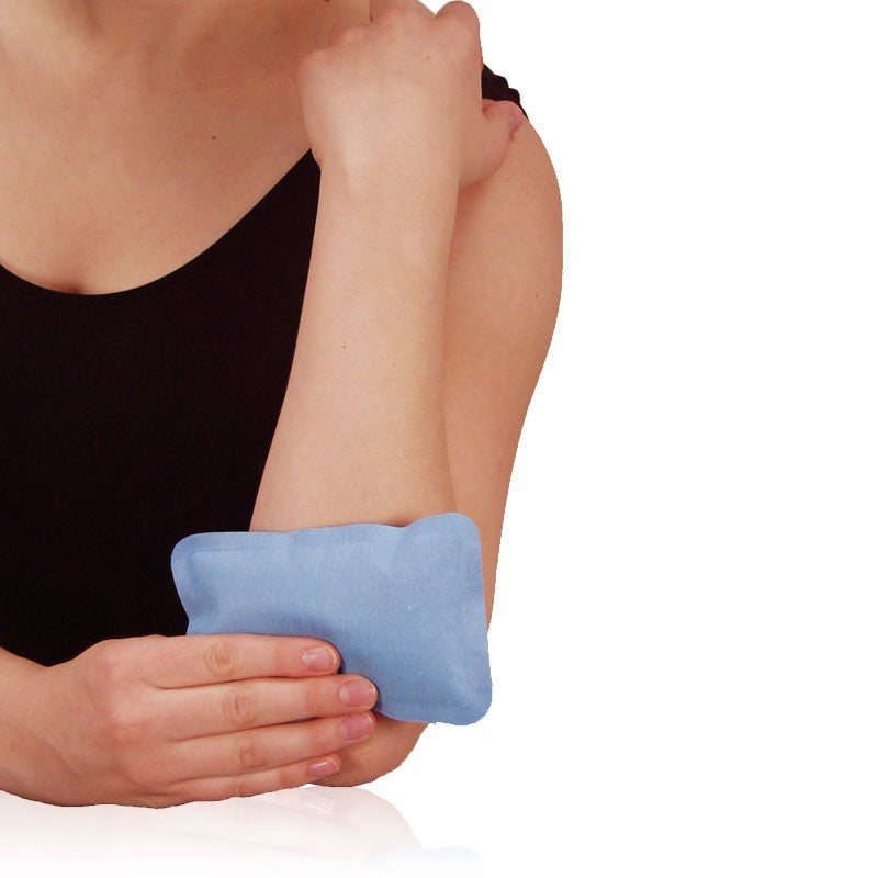 Woman holding a CorPak Soft Comfort pad on her elbow